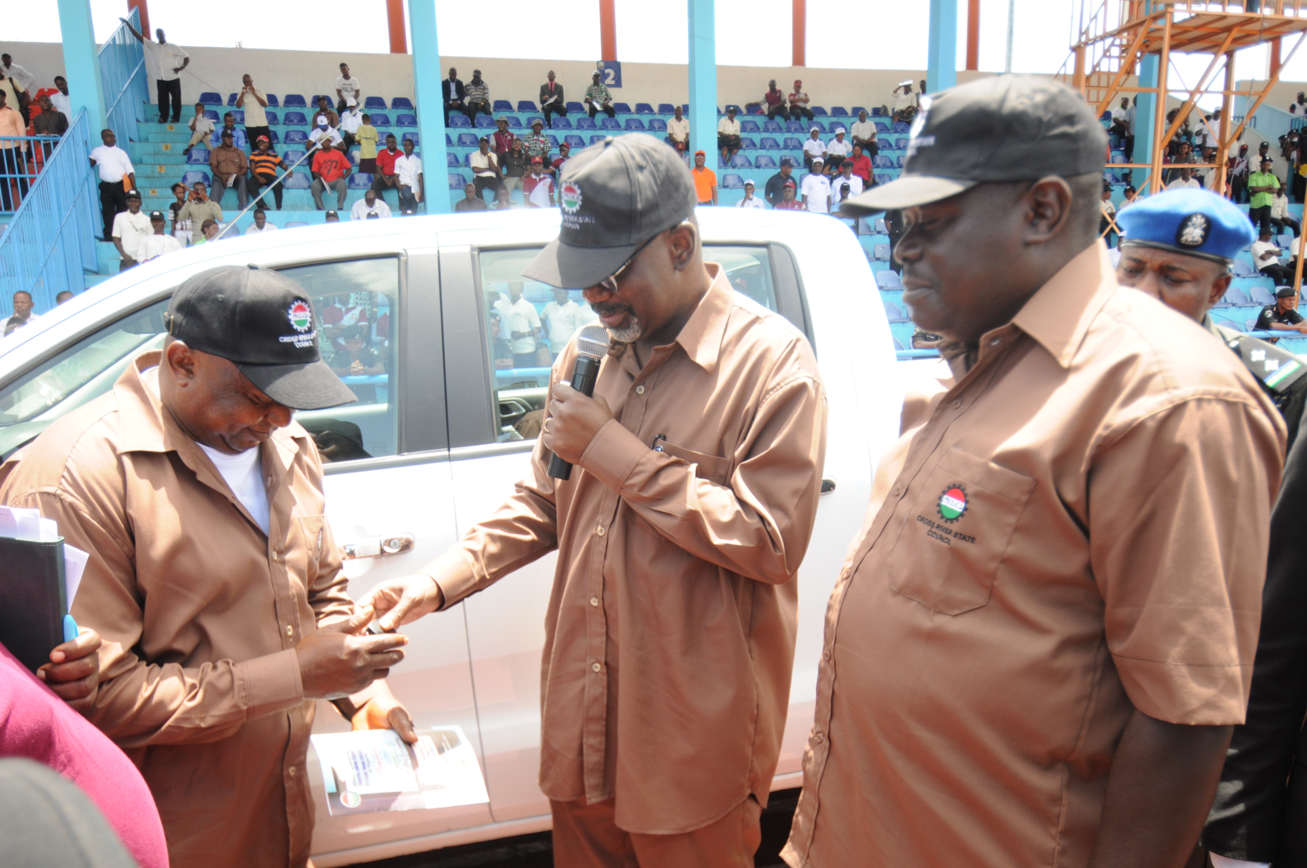 Cross River State Governor, Senator Liyel Imoke(M) presenting a Pick up van keys to the State Chairman, NLC, Comrade Nyambi Ojom while the Deputy Governor, Mr. Efiok Cobham watches when the governor presented vehicles to trade unions to mark the 2013 May Day in Calabar today