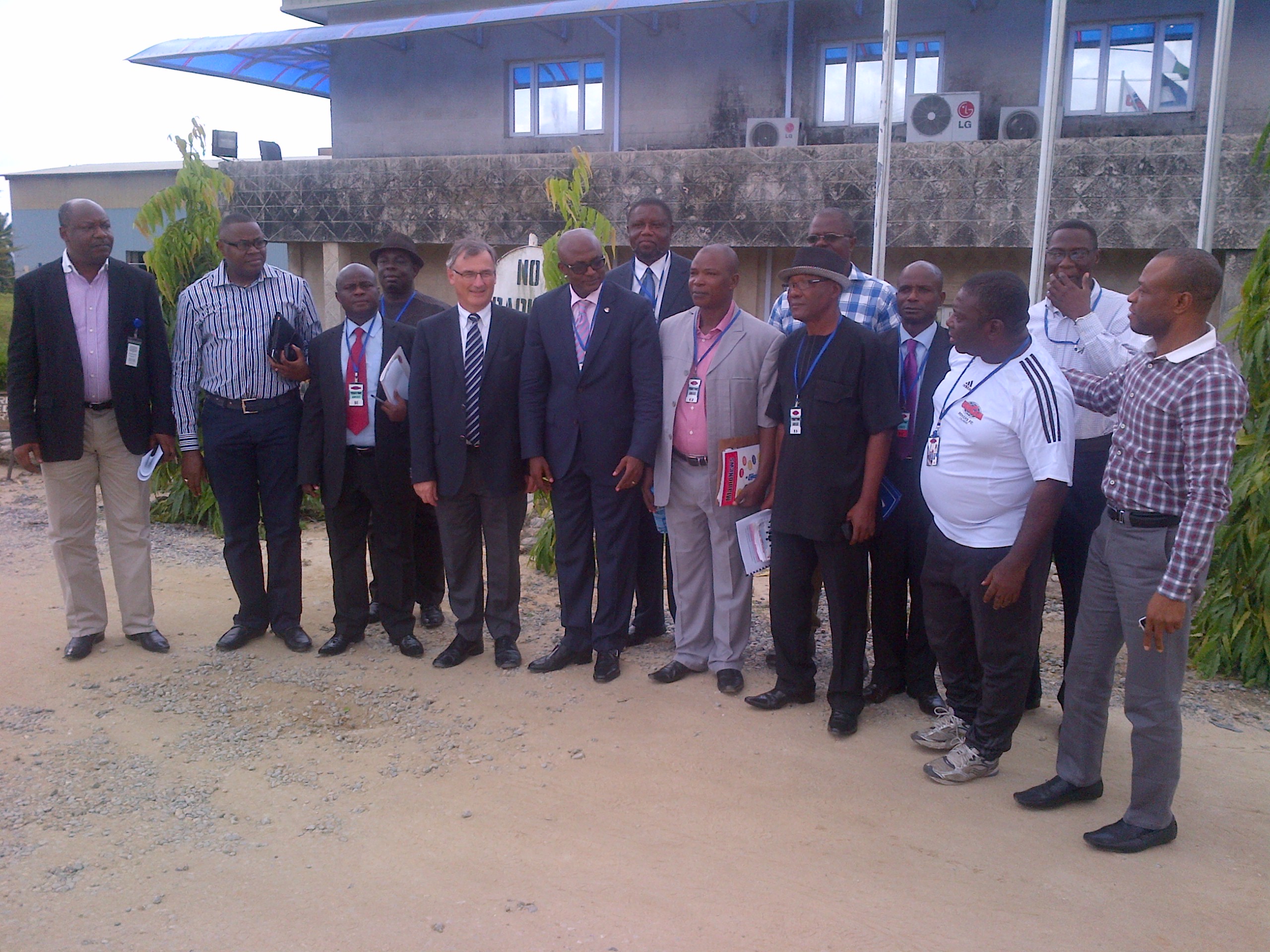 Cross River Commissioner For Youth and Sports Development, Patrick Ugbe with the Managing Director of Unicem in a group photograph with the management of the company