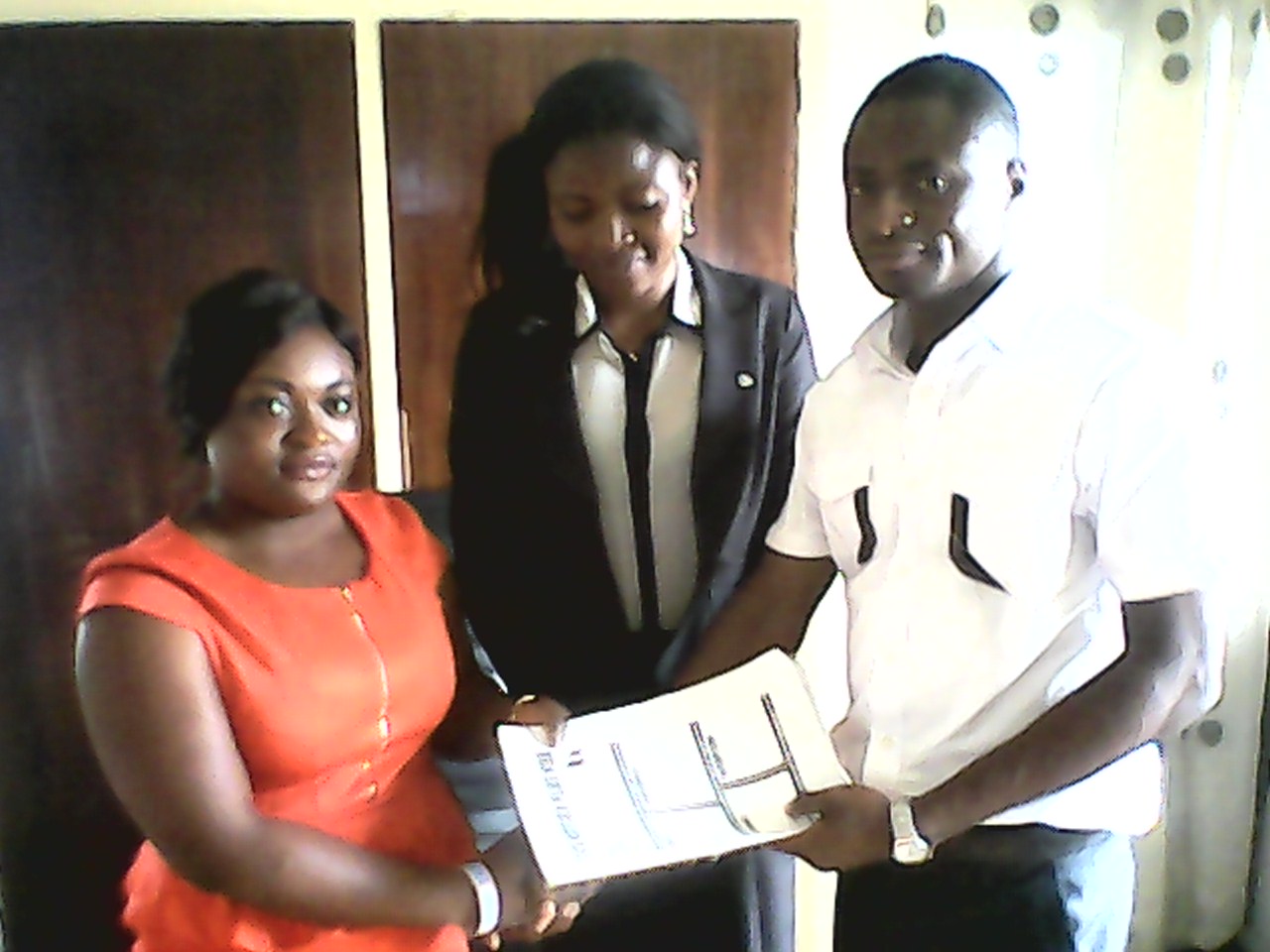 Comrade Ubi Emmanuel (right) handing over to his successor, Comrade Philomina Odah (left) while the new Vice President, Comrade Juliet Manyo (middle) watches