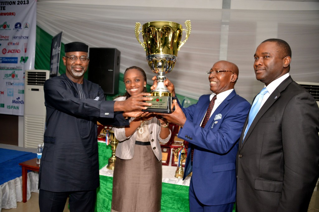 Cross River River Governor, Senator Liyel Imoke receiving a trophy as the ICT Governor of the Year from the President/Chairman of Council, ISPON, Mr. Chris Uwaje(2nd left),assisted by the Honorable minister for ICT, Mrs. Omobola Johnson while Mr. Odo Effiong SA to Imoke on ICT devt watched during the 2013 Institute's National Software Conference & Competition at Tinapa, Calabar
