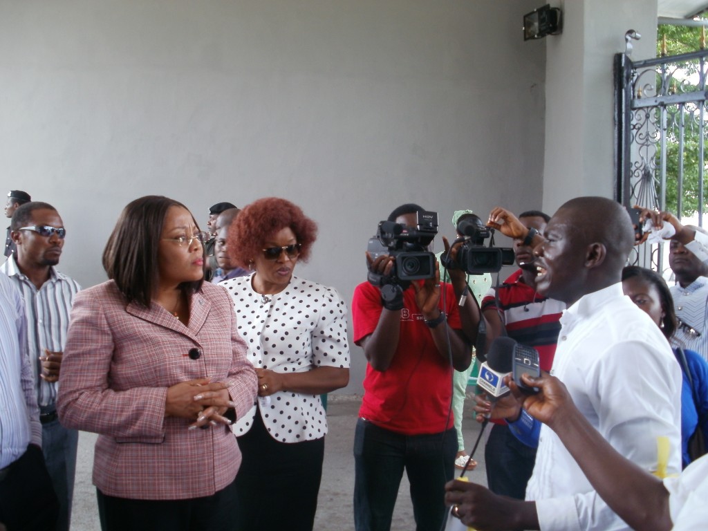 Bar. James Ibor, Executive Director, Basic Rights Counsel addressing the Press during an earlier protest to the ministry while the Commissioner, Bar. Patricia Endeley watches on