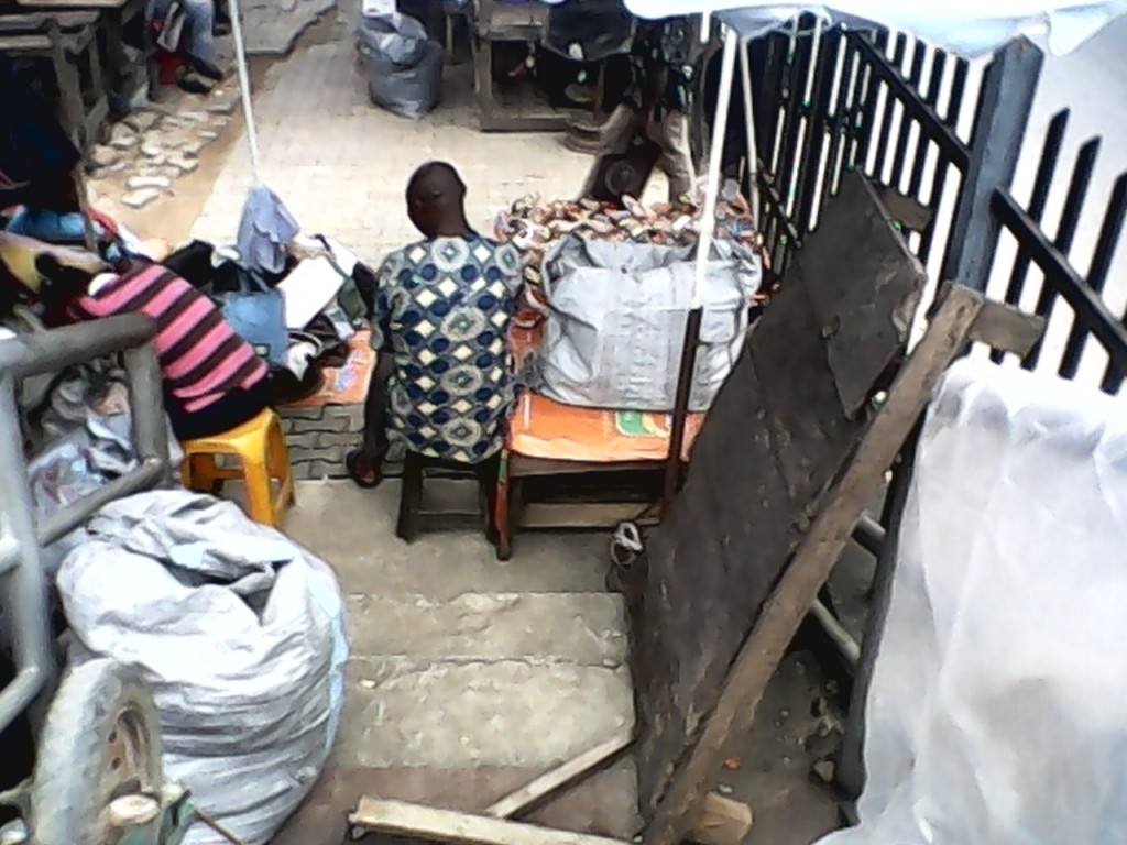 A trader displaying his wares along the staircase of the bridge