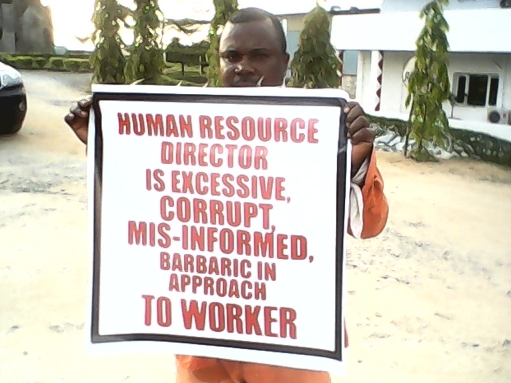 One of the protesters displaying a banner