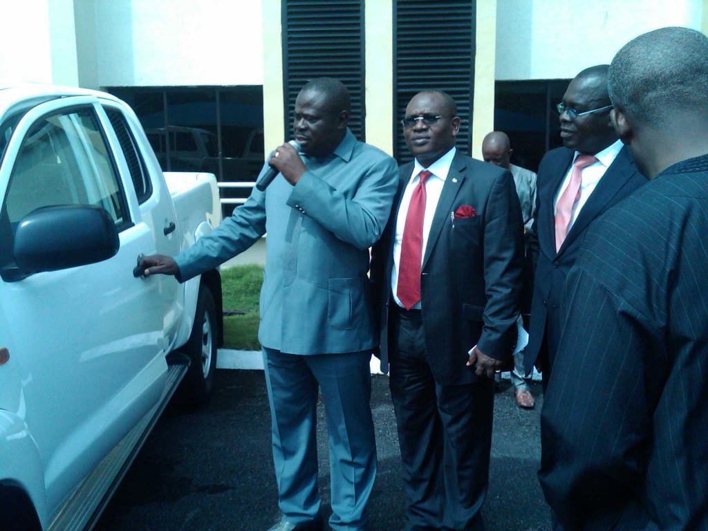 Deputy Governor, Efiok Cobham receiving the vehicles