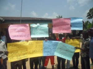 Cross section of Akansoko Youths bearing placards