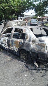 The bag snatchers Audi car that was set ablaze by the mob