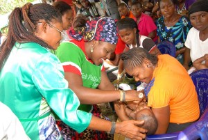 Hon Edith Amadi, Chairman Abi LGA immunizing a child during the exercise