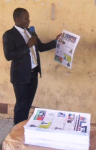 Comrade Ekemini Raymond John, NUCJ UCC Chapter President displaying a copy of the Newspaper