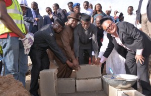 Cross River State Governor, Senator Liyel Imoke(m)assisted by Minister of Culture and Tourism, Chief Edem Duke, Arch Ladi Olatunde(L)and  MD Artee Group, Mr. Haresh Keswani  (R) during the foundation laying ceremony of  Calabar Shopping Mall, in Calabar