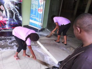 Staff of the resort sweeping water from the burnt theater picture credit: crossriverwatch.com