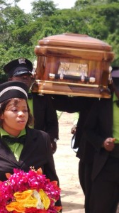 Pall bearers carrying late Mrs. Mbu's remains today