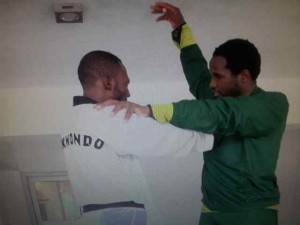 Chika Chukwumerije (dressed in green) and a trainee