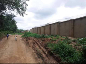 Part of the long perimeter fence of the DSS facility