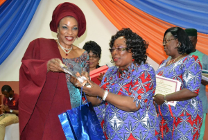 Mrs. Imoke receiving her award from the President of the Exquisite Ladies Foundation