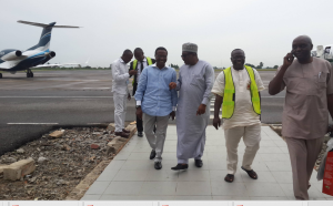 Jedy Agba (middle) chatting with Mr. Venatius Ikem on arrival at the Margaret Ekpo International Airport, Calabar