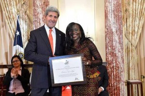 Beatrice Jedy-Agba, Executive Secretary of Nigeria’s National Agency for the Prohibition of Trafficking in Persons [NAPTIP] receiving the award from America's Secretary of State, John Kerry in the Benjamin Franklin Room of the US State Department