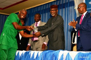 Governor Liyel Imoke receiving the award from Mr. Bernard Okorie while the SSG, Mr. Mike Aniah (left) and Commissioner for Youth and Sports, Mr. Patrick Ugbe (right) watch