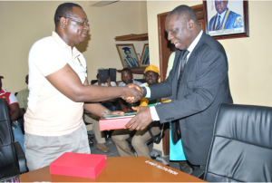 The National Coordinator of WAAPP-Nigeria, Prof. Chikwendu Damian receiving a gift from the Vice Chancellor of UNICAL, Prof. James Epoke during the visit