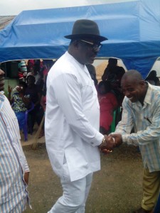 Hilliard Eta, National Vice Chairman, South South, APC greeting a member during the cross river ceremony in Calabar recently