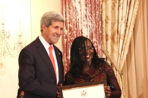 US Secretary of State, John Kerry (left) presenting the award to Mrs. Jedy Agba earlier in the year at the US State Department, Washington