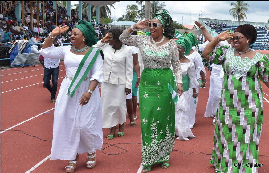 Wife of the Cross River State Governor, Mrs. Obioma Liyel Imoke (M) Deputy Governor's wife, Mrs Gloria Cobham(R) and wife of the Speaker of the State House of Assembly Mrs. Eneyi Larry Odey, giving the crowd a salute during the celebration of the nation's 54th Independence Anniversary in Calabar this morning