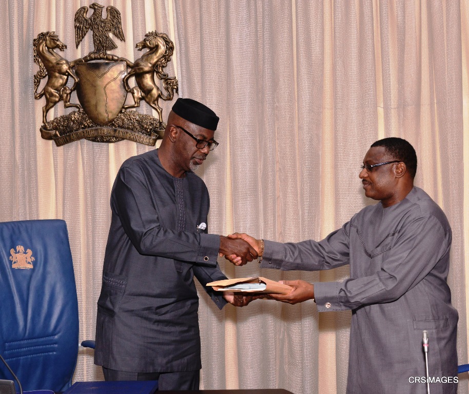 Cross River State Governor, Senator Liyel Imoke presenting a souvenir to visiting Resident Electoral Commissioner to the State, Dr. Okey Ezeani when the REC led his management team on a courtesy visit to Government House, Calabar, yesterday