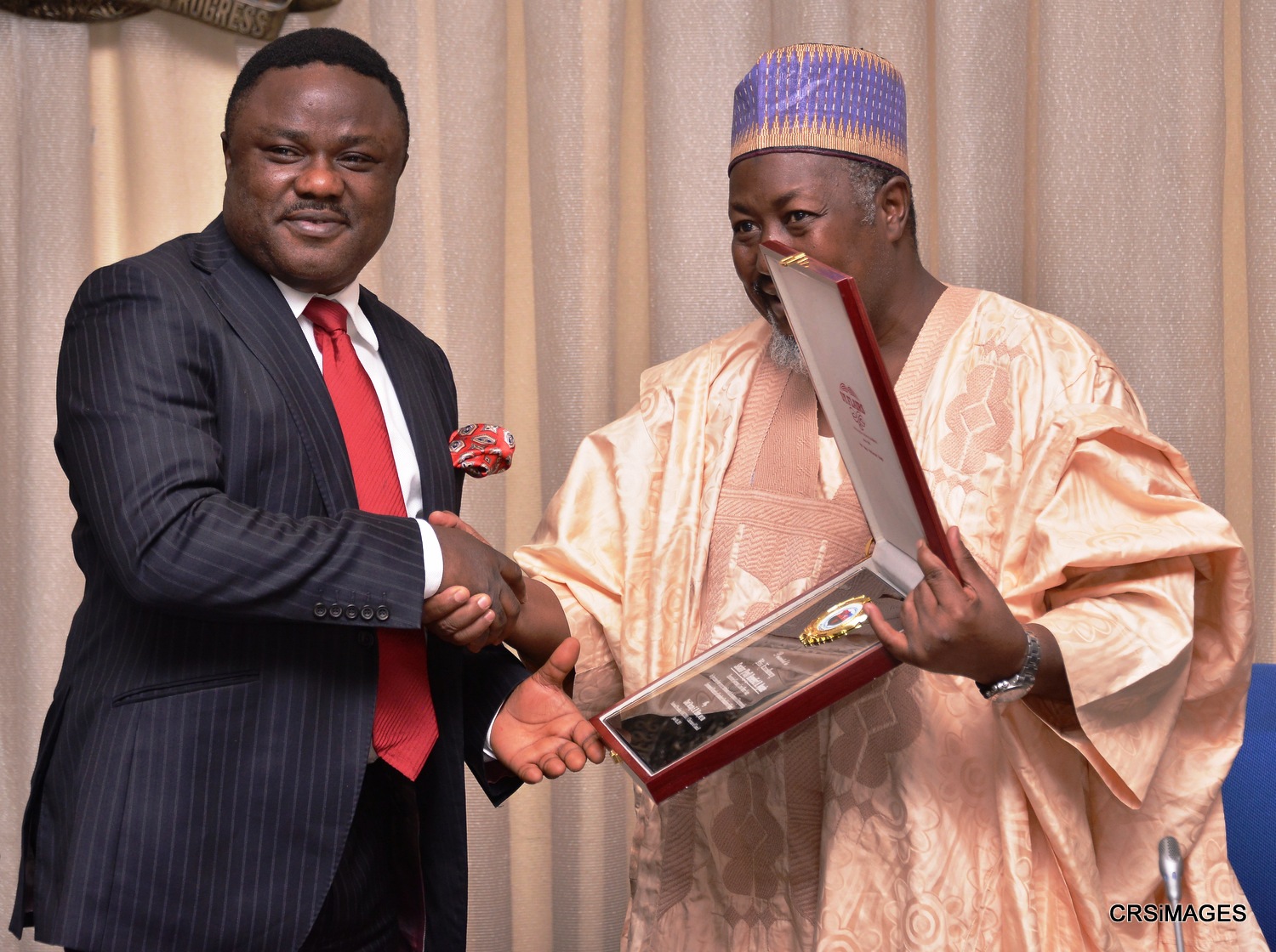 Cross River State Governor, Senator Ben Ayade being presented with a plague by Alhaji Muhammed B. Abubakar, Governor of Jigawa State and immediate past National President of Nigerian Association of Chambers of Commerce, Industry, Mines and Agriculture (NACCIMA) during a courtesy call in Government House Calabar, today