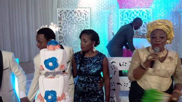 Former Spokesperson of the Department of State Security DSS, Ms. Marilyn Ogar, (R) cutting the cake with Nelly Abi and Obiom Enagu Ogar after the couple got wedded yesterday in Abuja