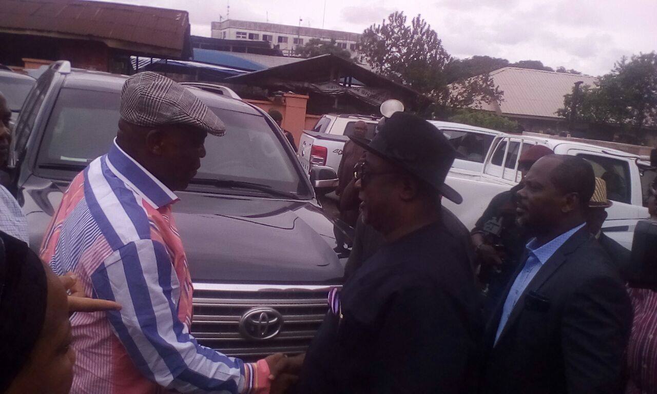 Raymond Dokpesi and Edim Inok shake hands shortly before Dokpesi's departure