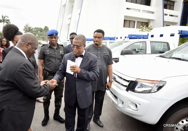 Deputy Governor of Cross River State, Prof. Ivara Esu handing over keys of the vans recently donated by the state to support Special Courts operation to its Chairman, Justice Maurice Eneji in Calabar while the Chief of Staff, Hon. Martins Orim watches on