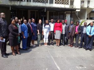 Attendees pose for a photograph after the meeting at the Ministry of Health headquarters