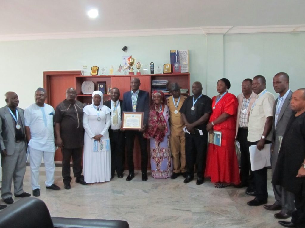 Speaker CRSHA, John Lebo (middle with certificate) poses for a photograph with UPF shortly after their visit to the assembly complex