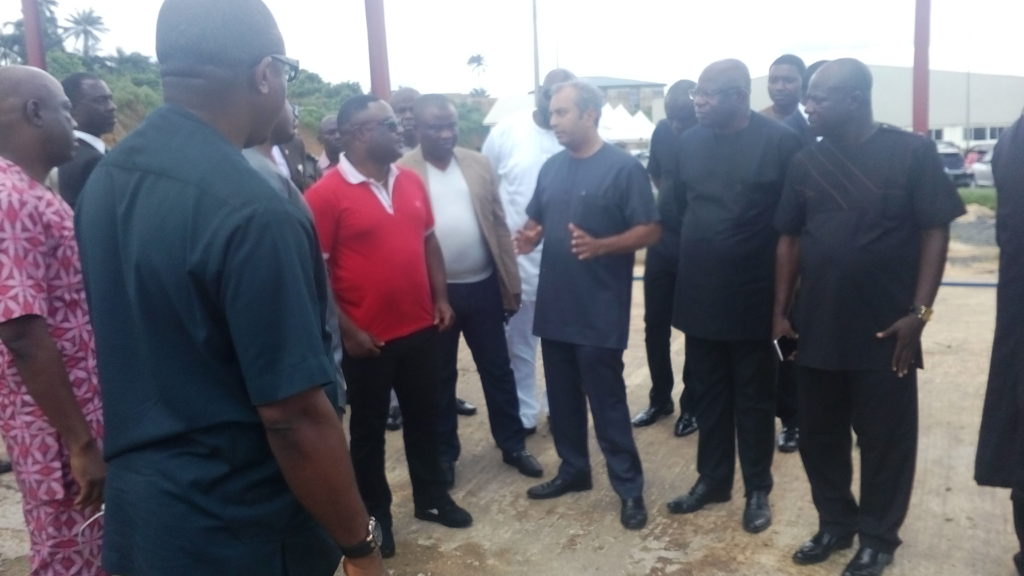 Governor Ayade (In Red) listening to the MD/CEO Dana Group of Companies Plc Jacky Hathiramani at the Calapharm site