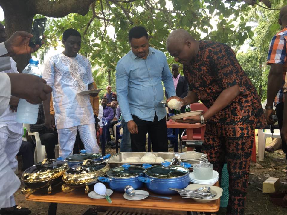 Legor Idagbo and Martins Orim sharing food with constituents (Photo Credit: Facebook/Legor Idagbo)