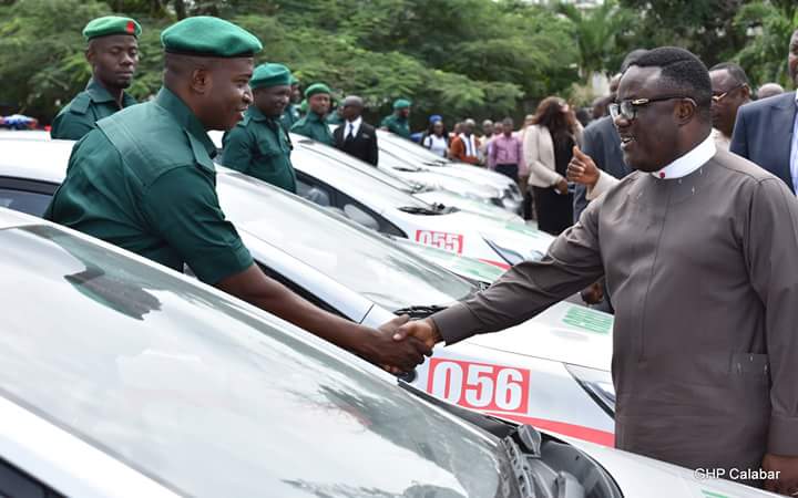 Governor Ben Ayade shakes one of the cadets after presenting them with keys to the vehicles, Friday. (Photo Credit: Govt House Calabar/Dan Williams)