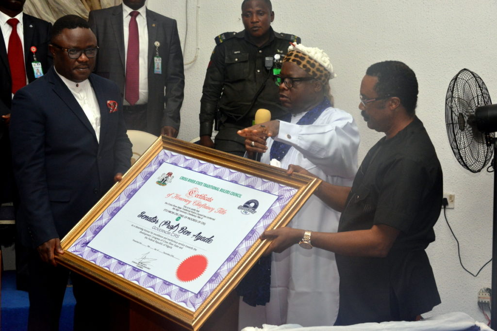 Governor Ben Ayade (L) receiving the certificate of chieftaincy from his Special Adviser Chieftaincy affairsJohn Eyikwaje (R) while Chairman Traditional Rulers Council Etinyin Etim Edet (middle) looks on