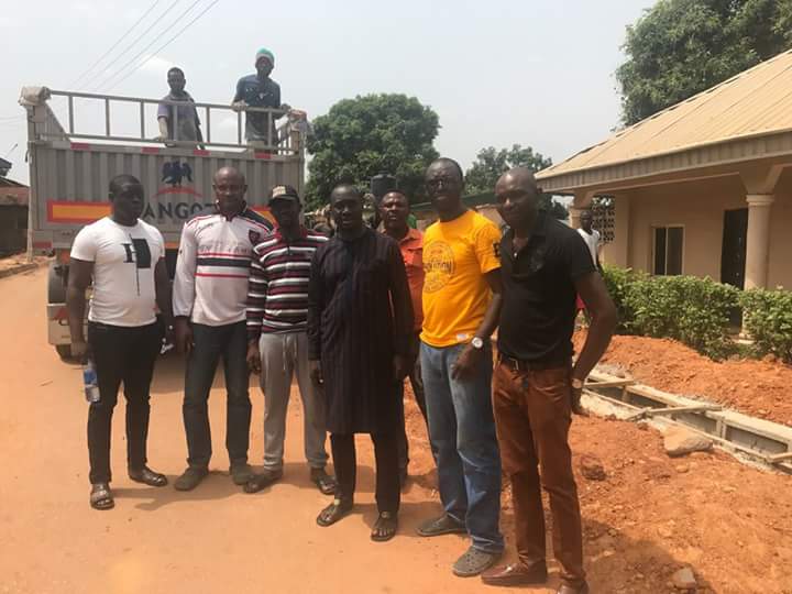 Rep Jarigbe Agom poses with members of his constituency shortly after an inspection of projects he attracted. Credit: Facebook/Roy Akpak
