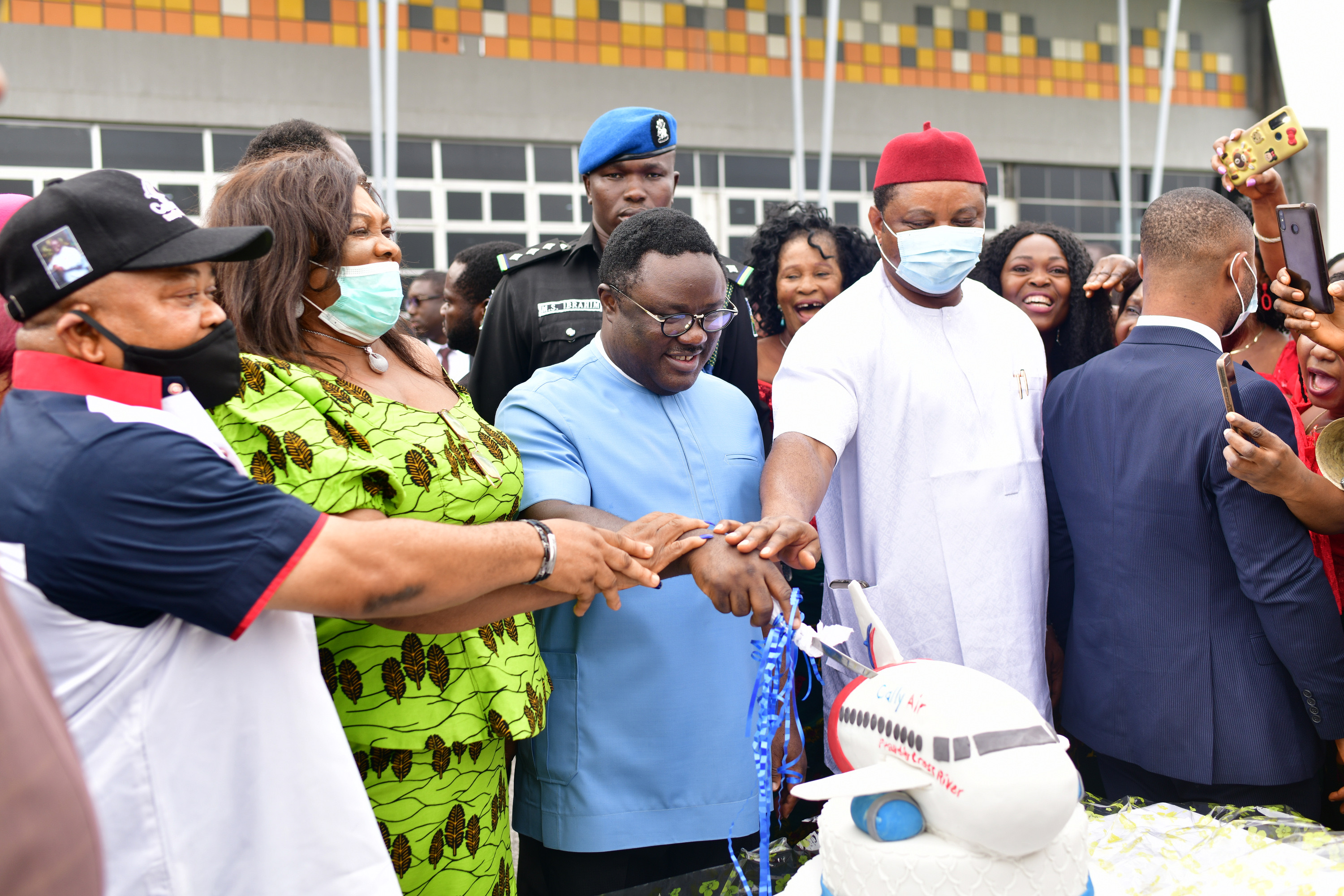 Cross River State Governor Sir Ben Ayade, (2nd R), his Chief of Staff, Hon. Martins Orim (1st R), the Secretary to State Government, Barr. Tina Agbor (2nd L) and the Commissioner for Aviation, RT Hon. Jake Otu Enya (1st R) in a symbolic cutting of cake to welcome Cally aircraft to the Margaret Ekpo International airport, Calabar - Monday (Credit: GHPC/Daniel Williams)