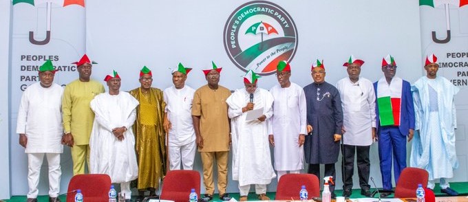 Chairman of the PDP Governors Forum and Sokoto State Governor, Aminu Waziri Tambuwal (M) reads the communique after a meeting of the PDP Governors at the IITA conference center in Ibadan, Oyo State. CRS Governor Benedict Ayade was absent