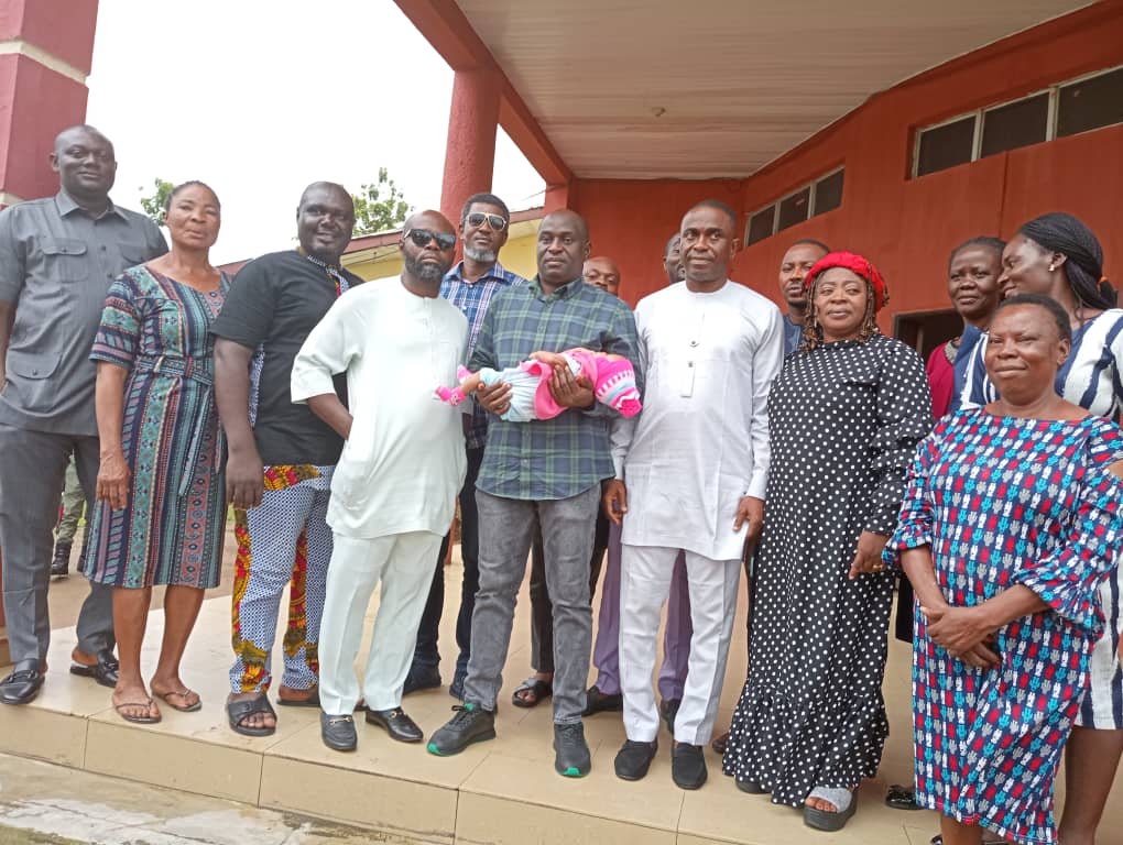 Deputy Speaker of the 10th CRSHA, Rt. Hon. Sylvester Agabi (M) holds a baby after visiting the Uwanse orphanage home in Calabar South to celebrate him 41st birthday anniversary