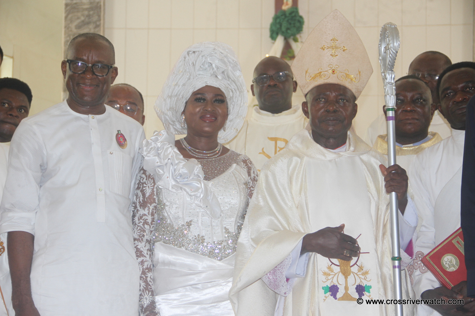 Nigeria's Sports Development Minister, John Owan Enoh (L); his wife, Mrs. Racheal Oka Owan Enoh (M) and the Bishop of Ogoja Diocese, Most Revd Dr. Donatus Akpan (R) during the Thanksgiving ceremony of the minister at Holy Family Parish at Ikom in Cross River State 6/1/2023 9Credit; CrossRiverWatch/Godwin Otang)