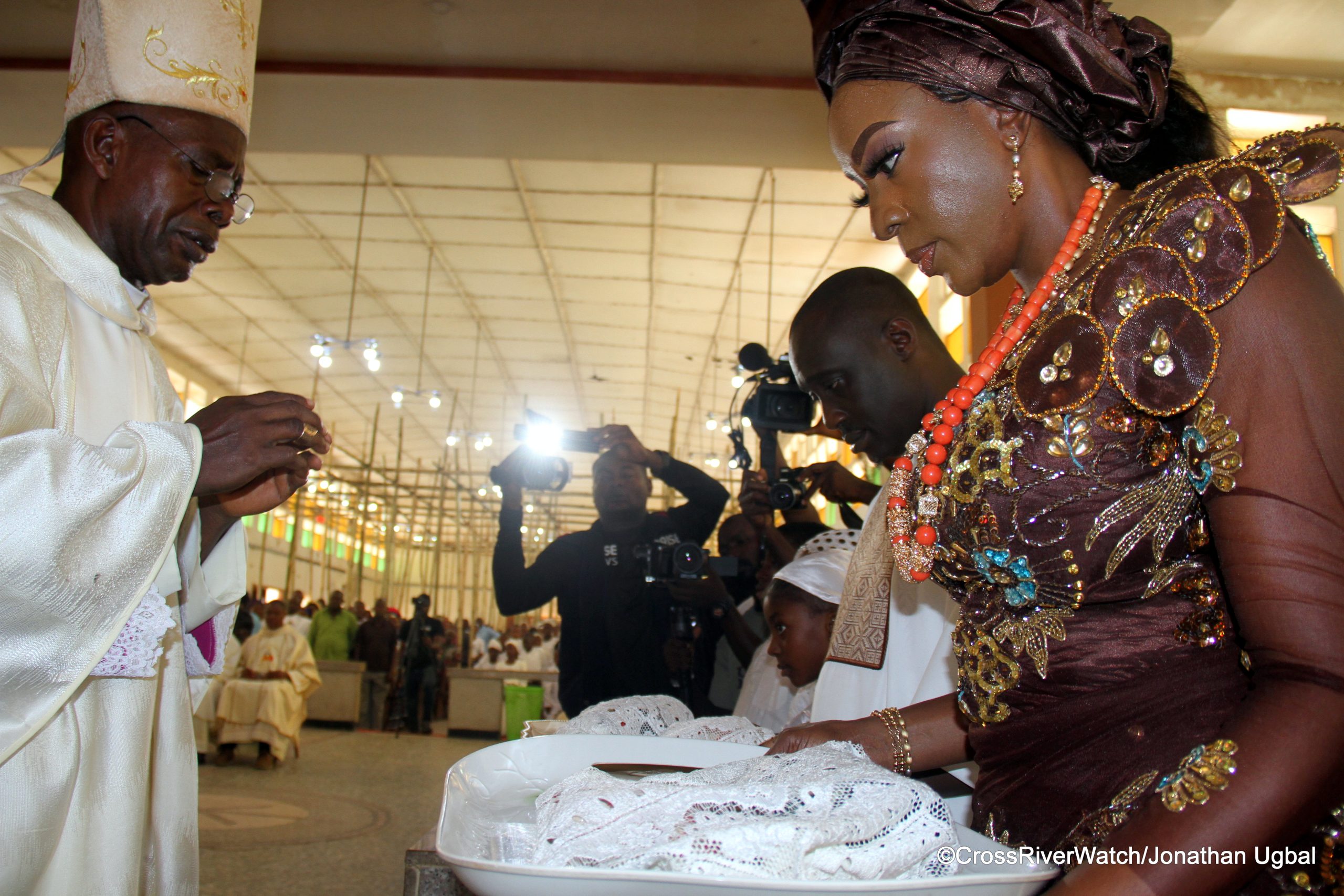 The Catholic Bishop of Ogoja Diocese, Most Revd Donatus Akpan prays for Senator Jarigbe Agom and his wife, Fifi during the duo's thanksgiving ceremony on Easter Sunday, 31/3/2024 at the St. Benedict's Cathedral in Ogoja. (Credit; CRW/Jonathan Ugbal)