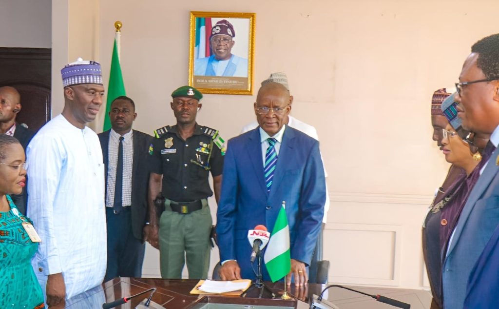 Industry Minister, Senator John Owan Enoh and Permanent Secretary of the FMITI, Ambassador Nura Rimi during a meeting by the minister with staff after assumption of duties Tuesday in Abuja, FCT. (Credit: FMITI/Diana-Mary Nsan)