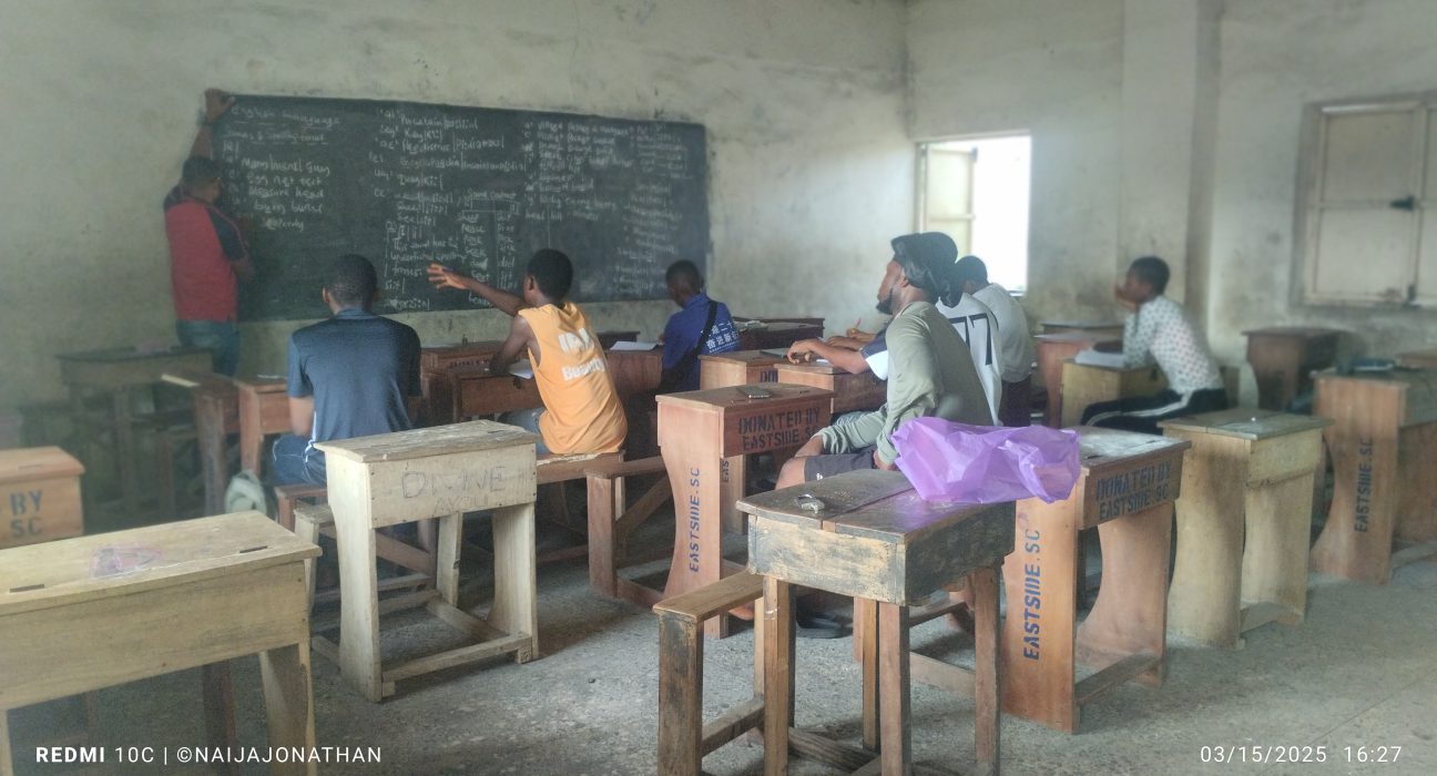 Candidates listening to a tutor at one of the study centers