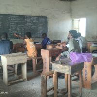 Candidates listening to a tutor at one of the study centers