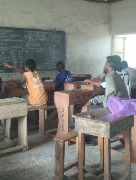 Candidates listening to a tutor at one of the study centers