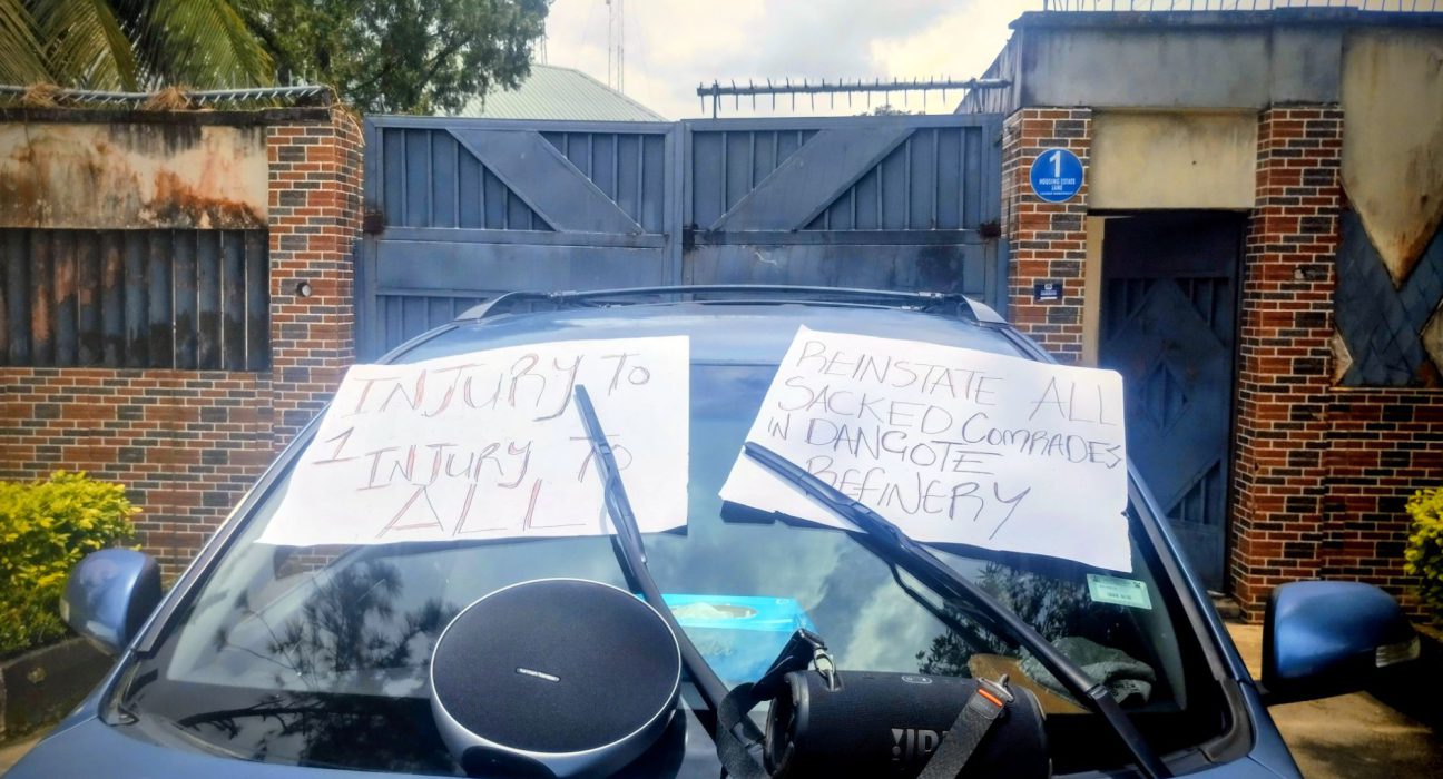 Placards used by members of PENGASSAN displayed on a vehicle used to barricade the entrance to the Cross River State office of the Nigerian Midstream and Downstream Petroleum Regulatory Authority, NMDPRA (29/9/2025)