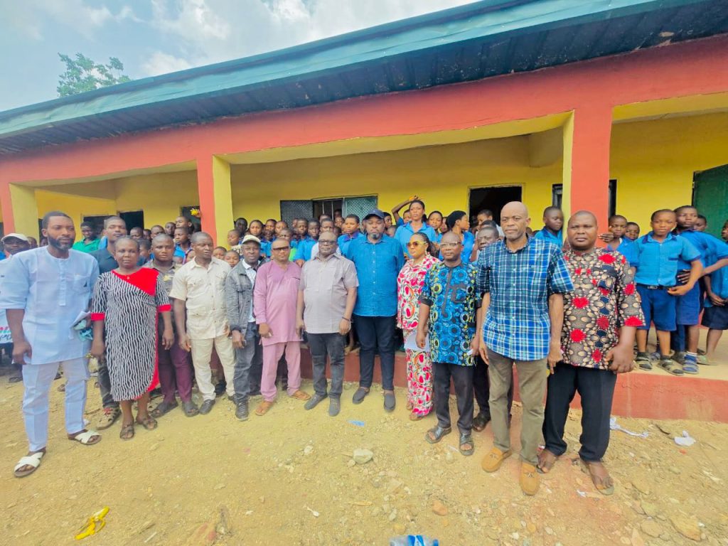 Staff and Students of the school pose for a photograph with Hon. Akpanke and associates