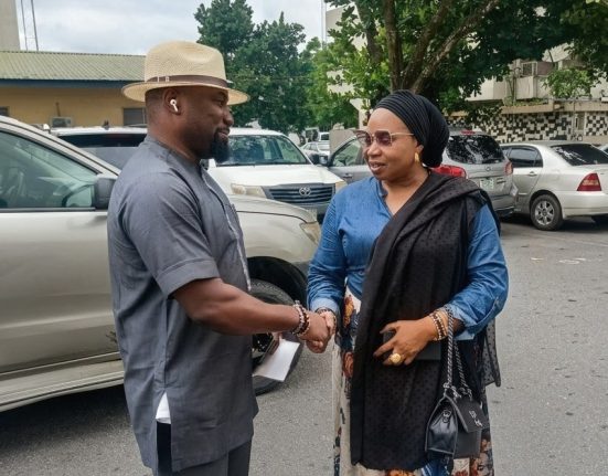 Captain Edom Tawo on the left shaking hands with Hon. Blessing Egbara at the Old Secretariat Complex in Calabar